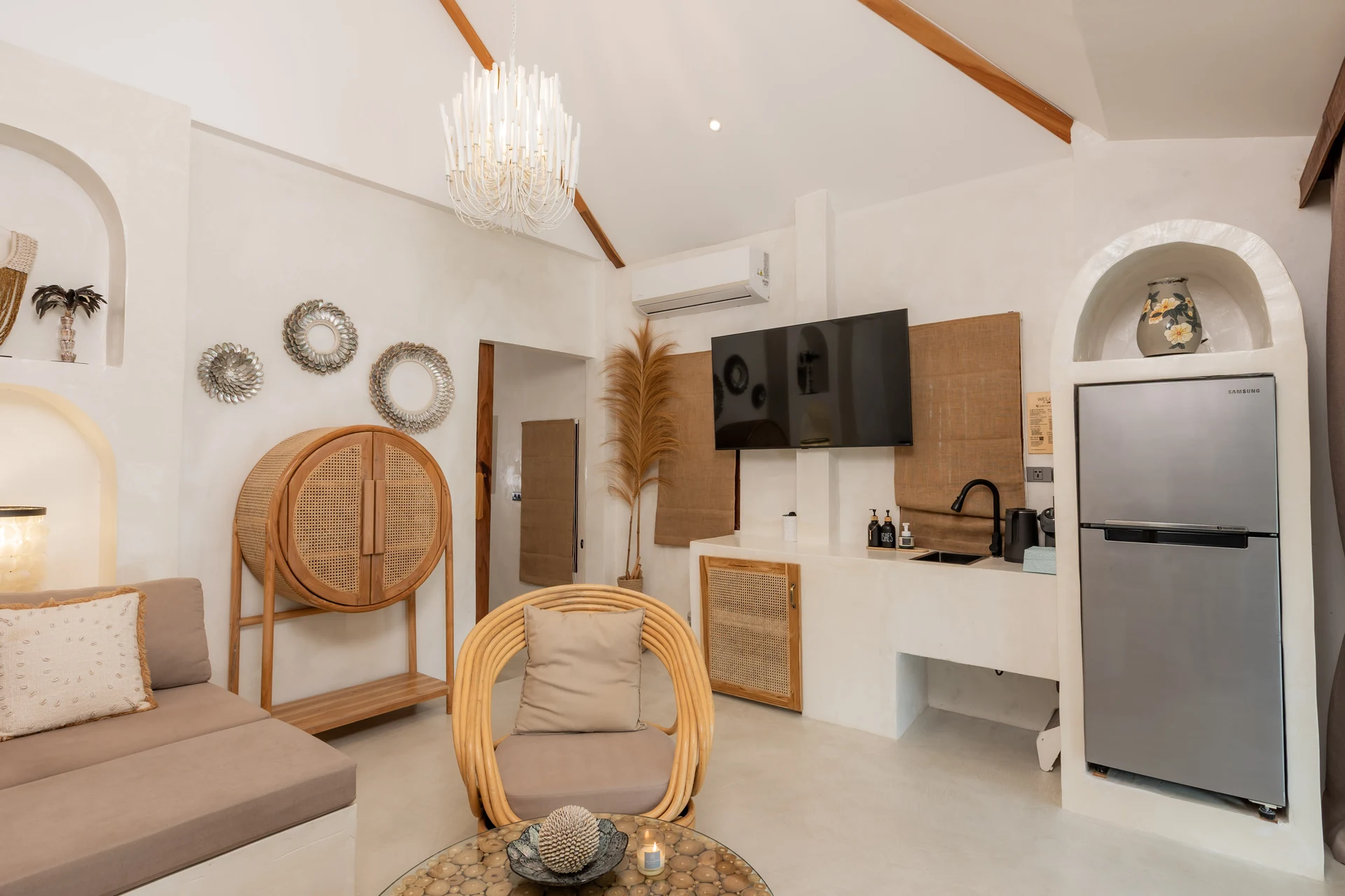 Comfort Villa — boho living room with rattan seating (Villa Ginger) — photo 16