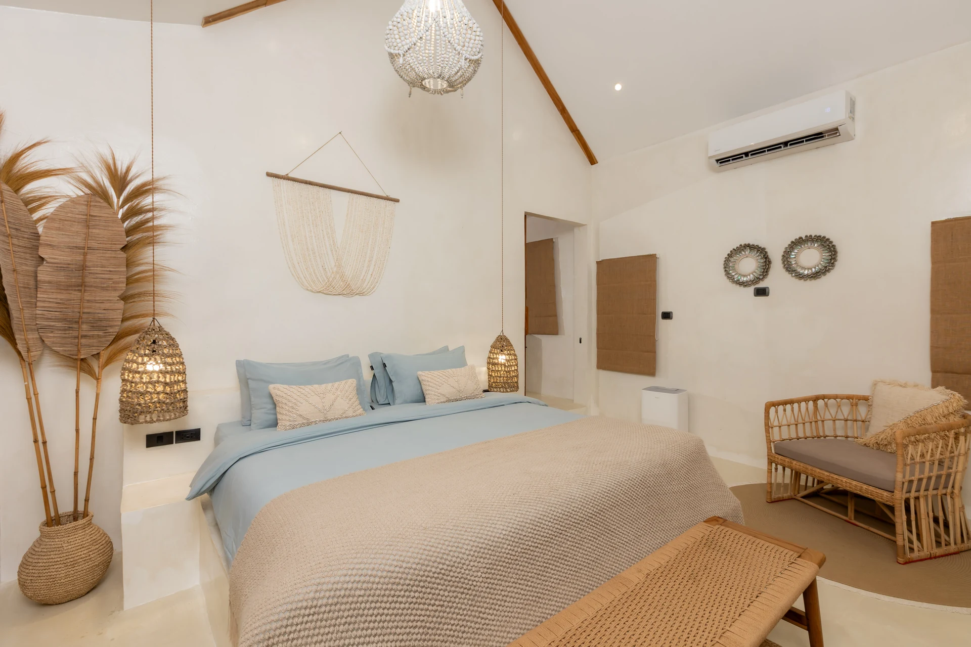 Comfort Villa — boho living room with rattan seating (Villa Ginger) — photo 17