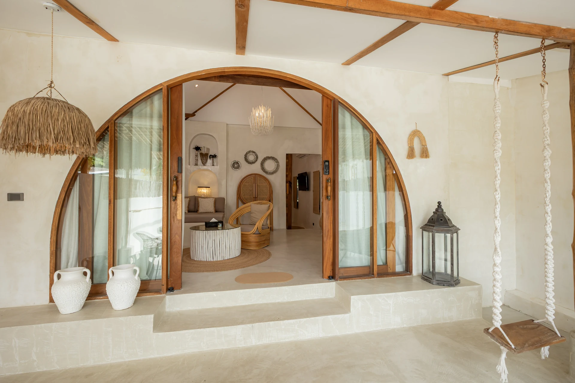 Comfort Villa — boho living room with rattan seating (Villa Ginger) — photo 38