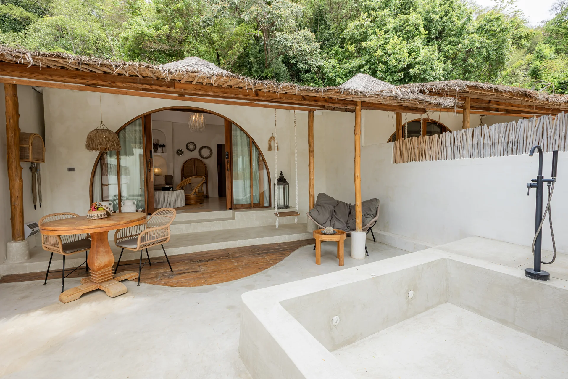 Comfort Villa — boho living room with rattan seating (Villa Ginger) — photo 41
